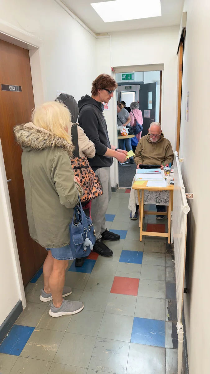 Friendly check-in and support coordination desk at Trinity Mission Castleford