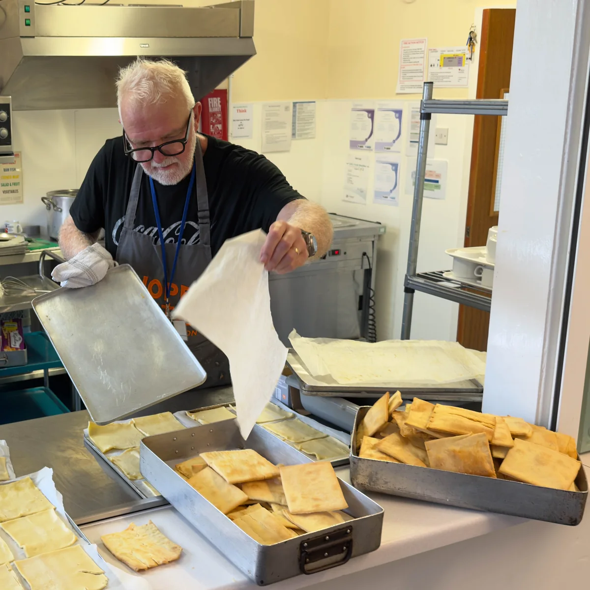 Trinity Mission volunteer chef preparing fresh baked pastries in the Hope Centre kitchen